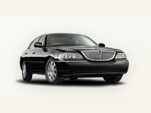 Black executive sedan on a light studio background